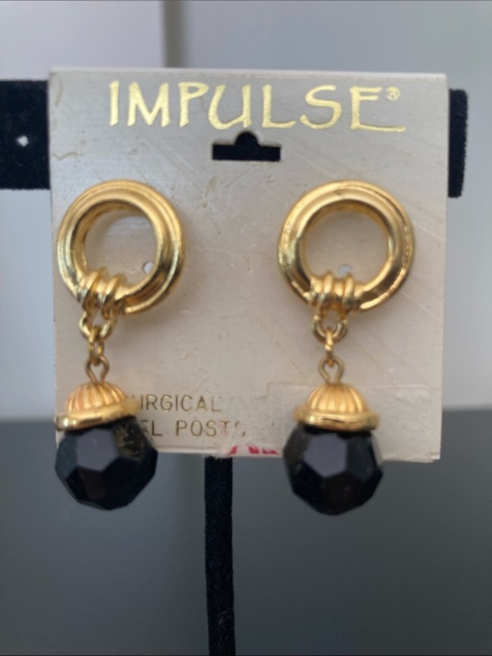 Impulse Gold Hoop Earrings with Black Faceted Drops